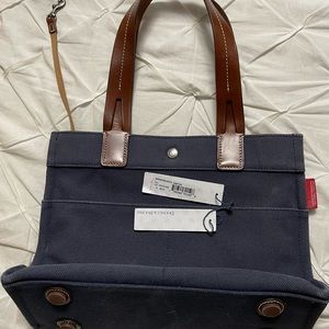 Dooney & Bourke small tote, navy blue, deep brown leather handles, gently used
